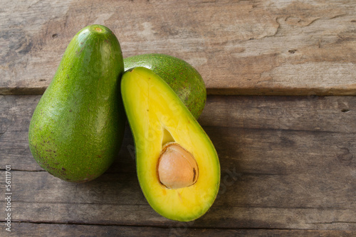 Avocado on wood background