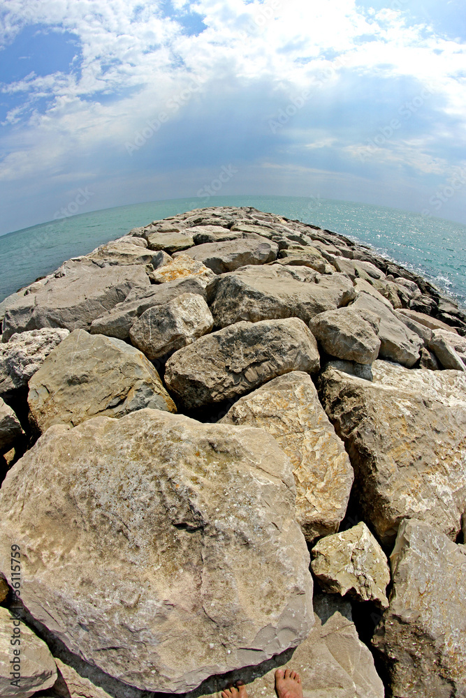 seaside rocks and breakwaters photographed with the fisheye lens