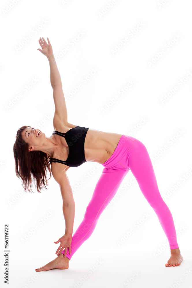 Pretty Woman in Yoga Pose - Triangle Position. Pretty Woman in Yoga Pose - Triangle Position.