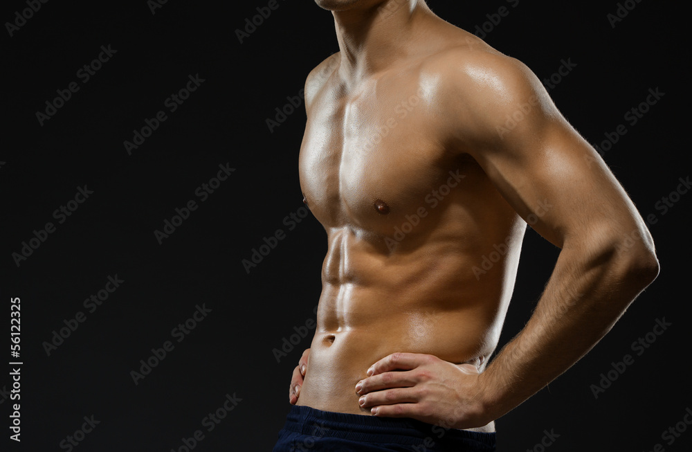 Close up of naked male's chest, isolated on black Close up of naked male's chest, isolated on black