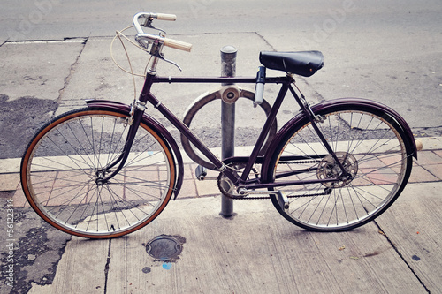 An old bicycle locked up on the street in Toronto