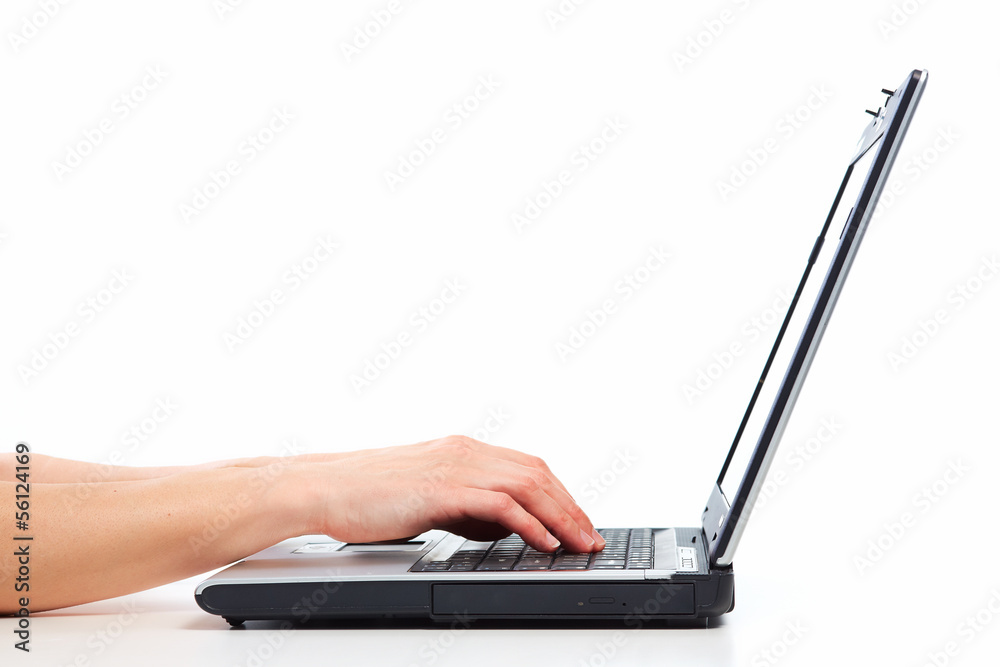 Hands with laptop computer.