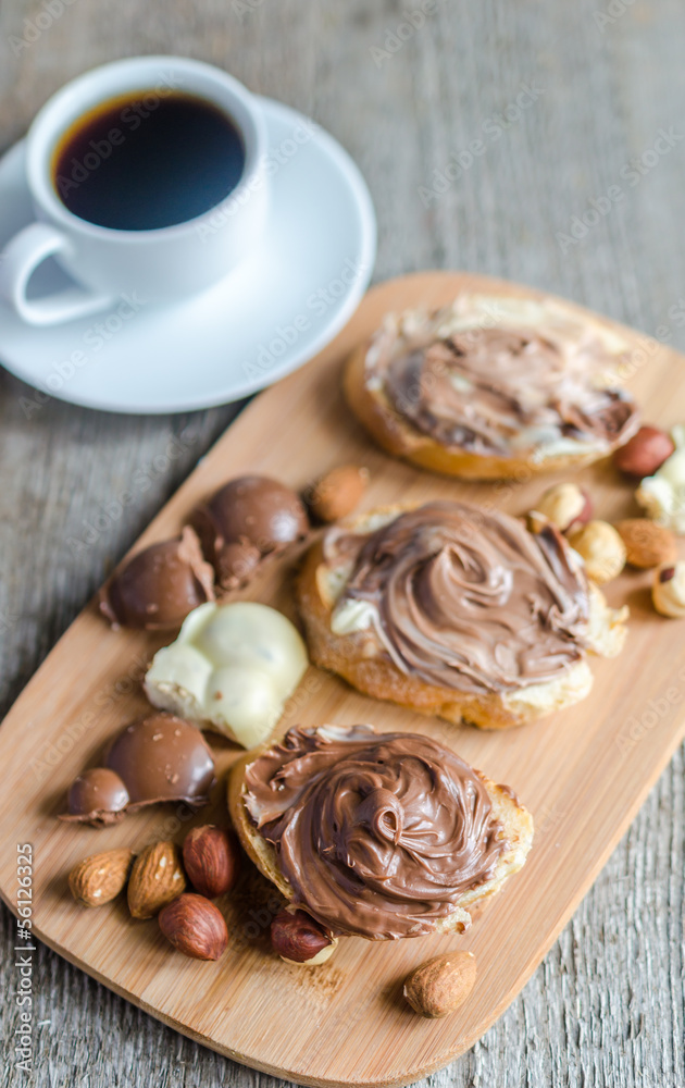 Slices of bread with chocolate cream and nuts Slices of bread with chocolate cream and nuts