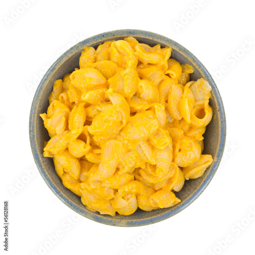 Cheesy pasta shells in bowl on white background