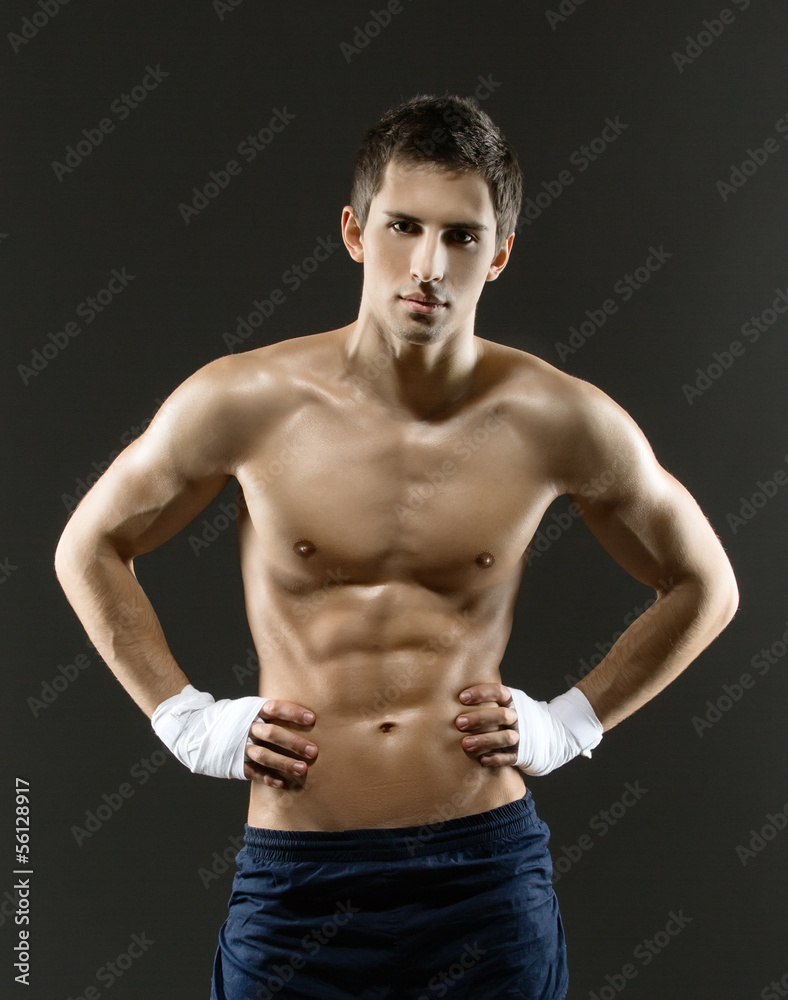 Half-length portrait of half-naked boxer with hands on hips Half-length portrait of half-naked boxer with hands on hips