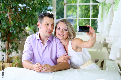 Young couple  taking  photo...