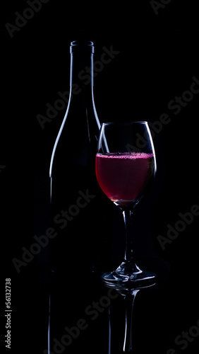 Red wine bottle and full glass