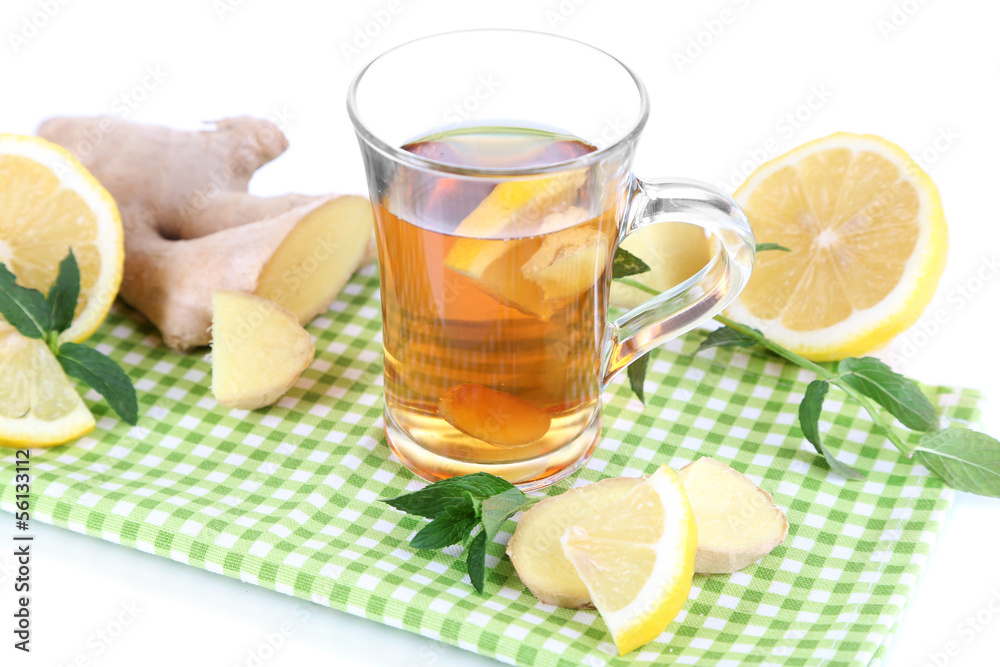 Cup of tea with ginger on napkin isolated on white Cup of tea with ginger on napkin isolated on white