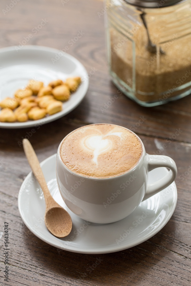 close up a cup of coffee on wooden table close up a cup of coffee on wooden table