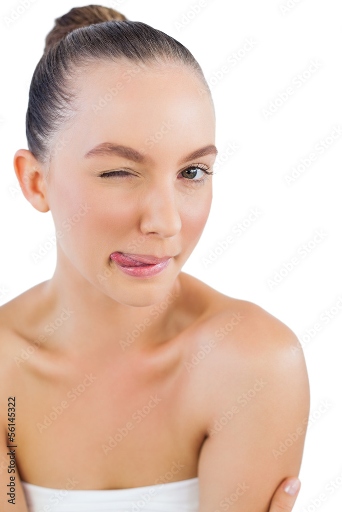 Model posing with tongue out and winking Model posing with tongue out and winking