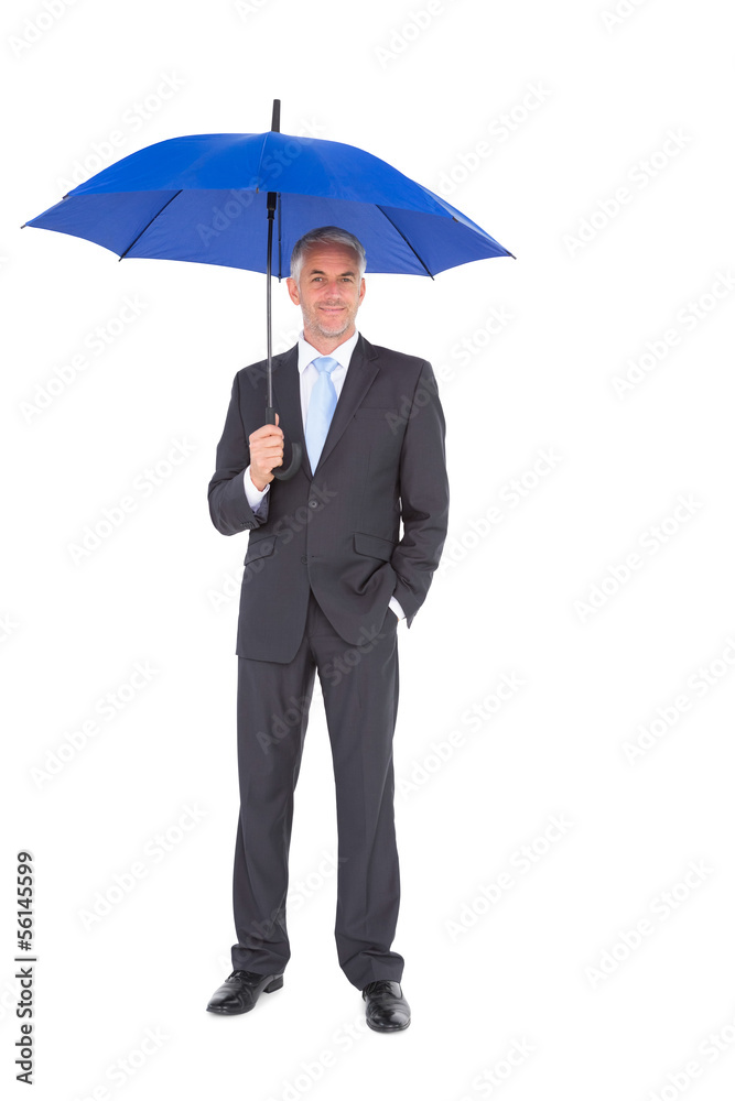 Businessman smiling at camera and holding blue umbrella Businessman smiling at camera and holding blue umbrella