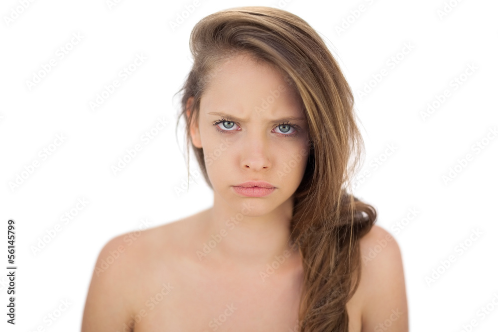 Frowning brunette model looking at camera Frowning brunette model looking at camera