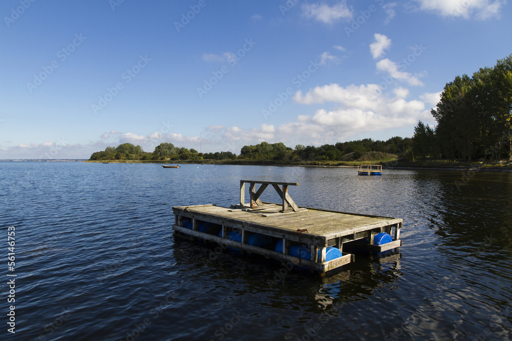 wooden raft on water in denmark