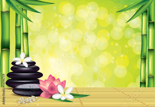 Spa stones and flowers on bamboo background