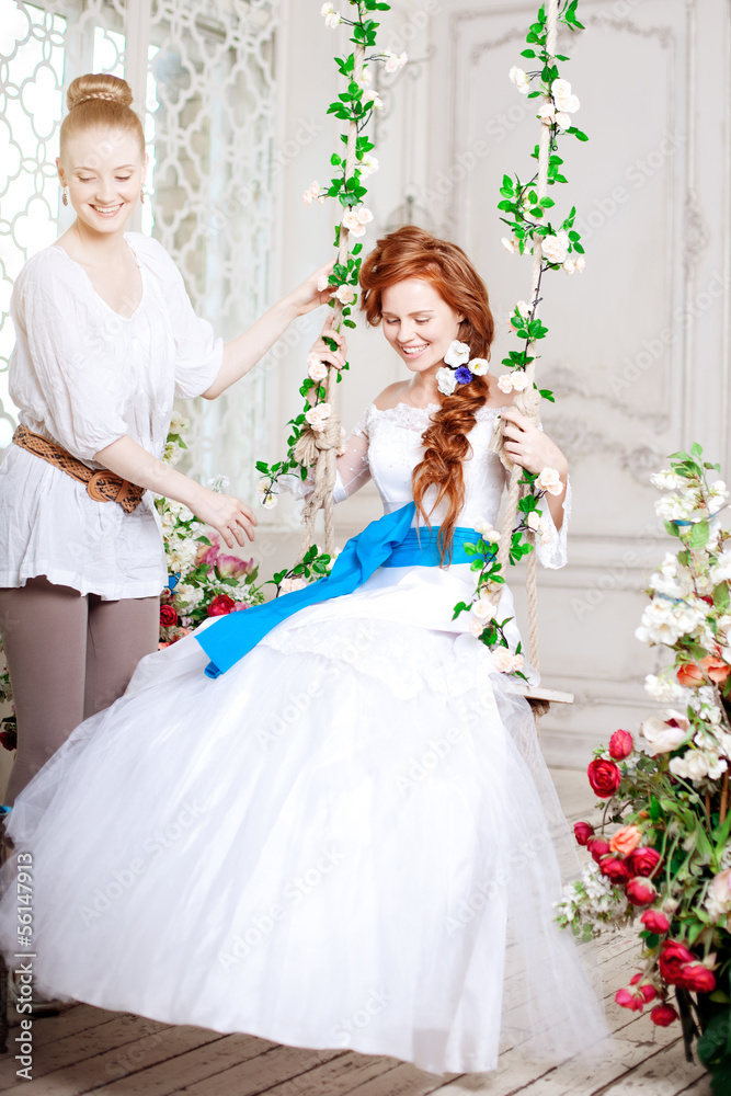 Fototapeta premium Beauty bride in a luxurious interior with flowers