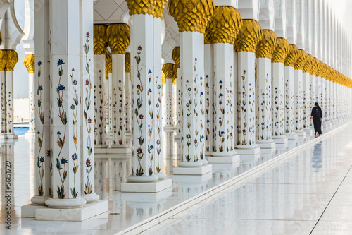 Hallway with golden decorated pillars at the entrance of the wor photo