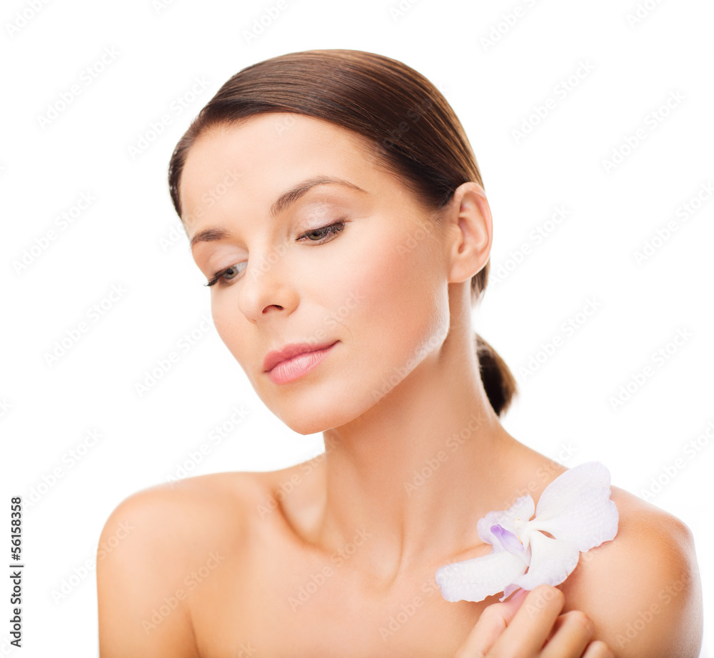 relaxed woman with orhid flower