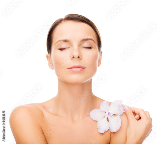 relaxed woman with orhid flower