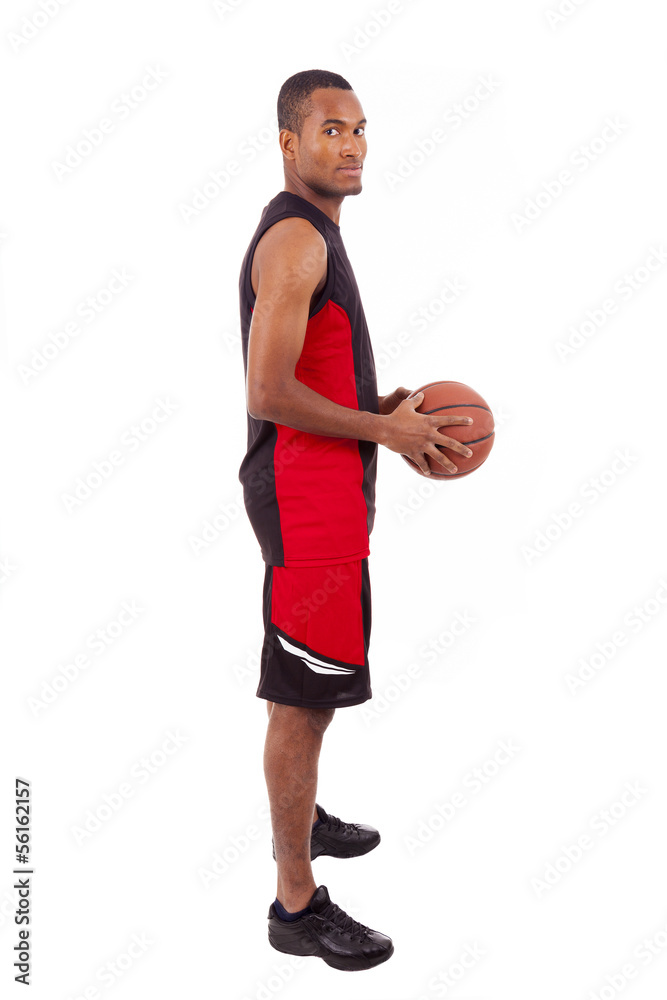 Side view of a basketball player isolated in white background