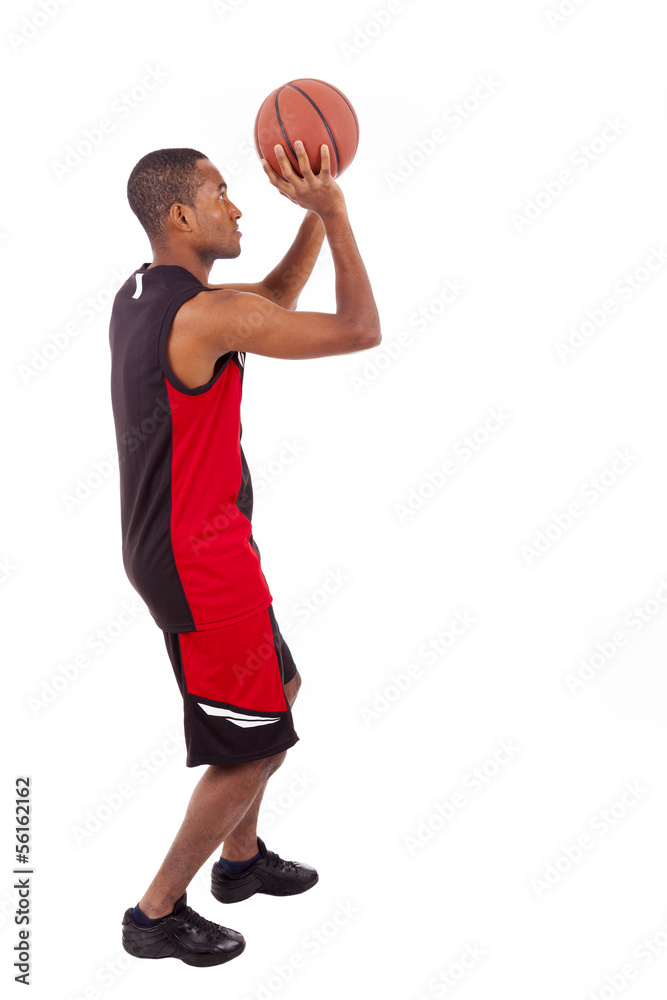 Side view of a basketball player isolated in white background