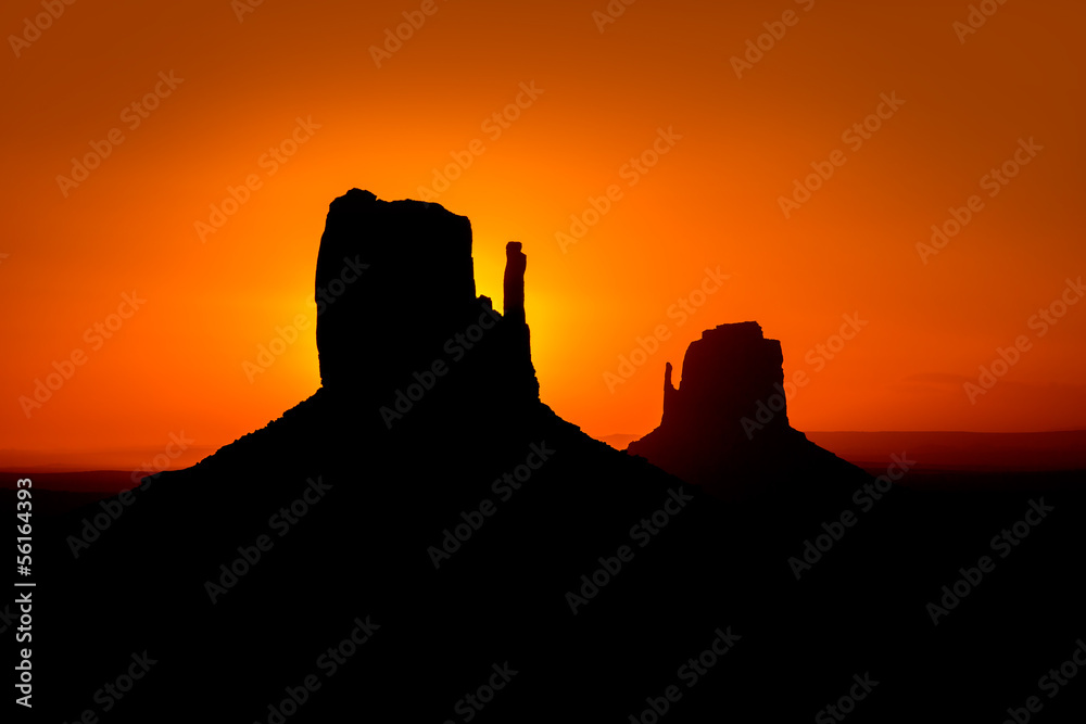 Sunrise at Monument Valley West and East Mittens Butte