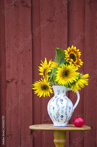 Fototapeta Naklejka Na Ścianę i Meble -  summer time sunflowers beautiful bouquet in elegant pitcher