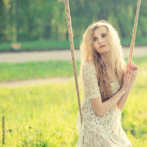 beautiful girl on a swing