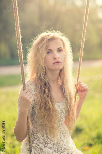 beautiful girl on a swing