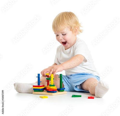 Kid playing logical education toys with great interest