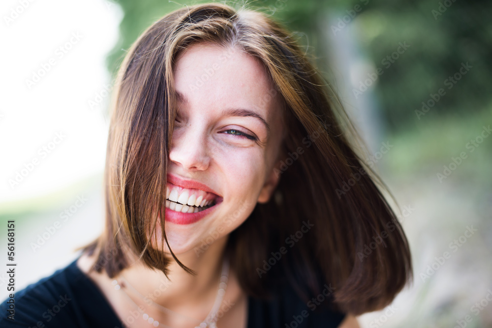 portrait of a beautiful young woman laughing portrait of a beautiful young woman laughing