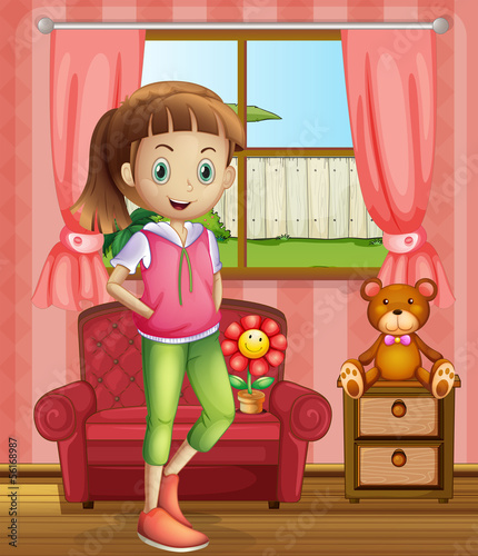 A cute young girl inside the house