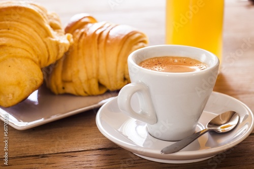 Breakfast with coffee and croissants of custard