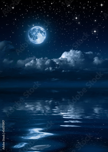 moon and clouds in the night on sea