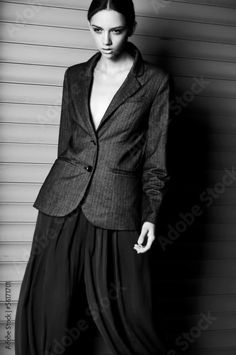 Fashion women dinamic move in suit on gray background