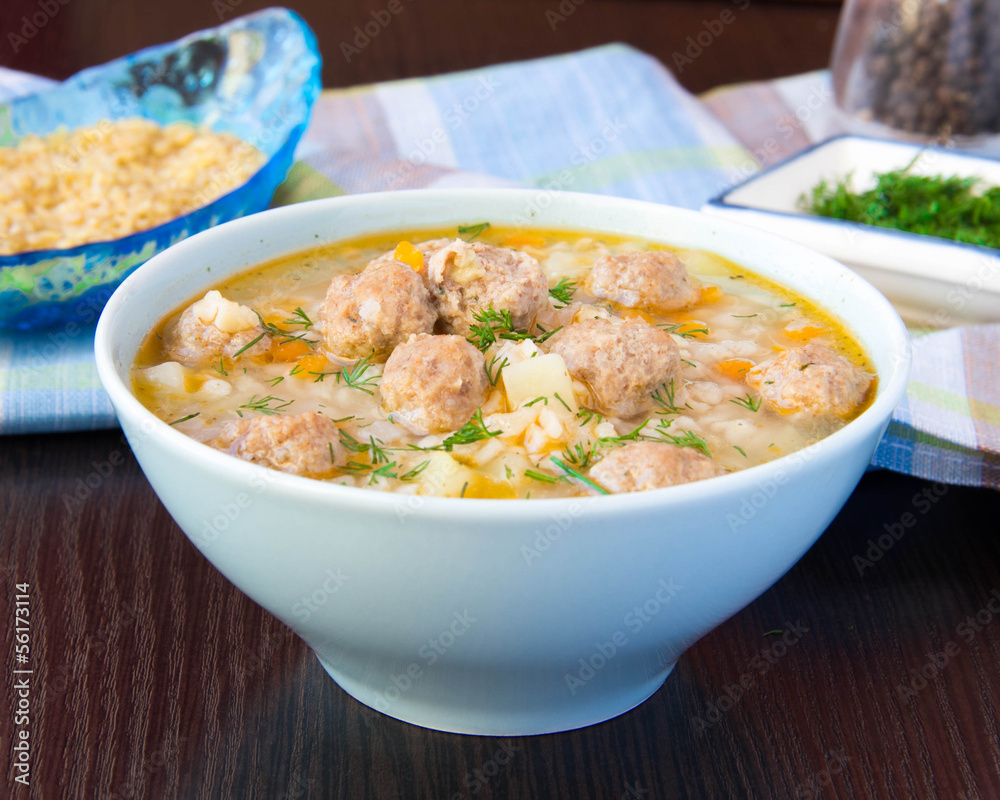 Delicious and healthy hot soup with barley bulgur and small meat Delicious and healthy hot soup with barley bulgur and small meat