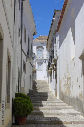 Typical narrow street in Tavira, Algarve, Portugal © gadzius