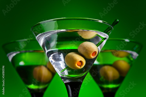 glasses with martini and green olives