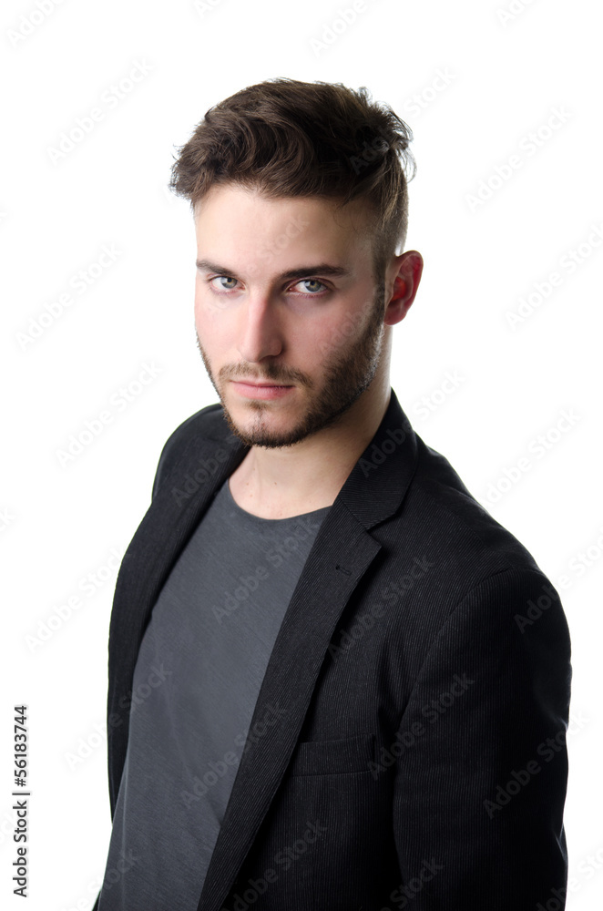 Handsome young business man looking in camera, serious Handsome young business man looking in camera, serious