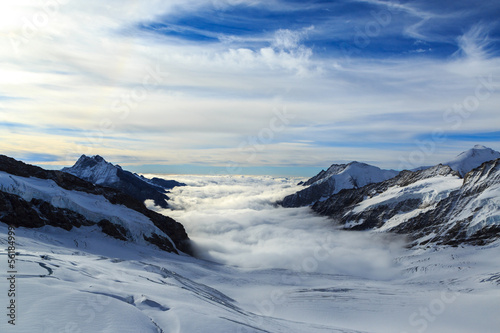 Mountain peaks above the clouds in the Swiss Jungfrau region