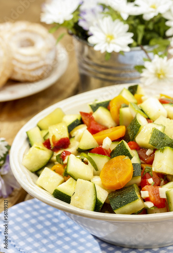 Fresh vegetable salad in white bowl