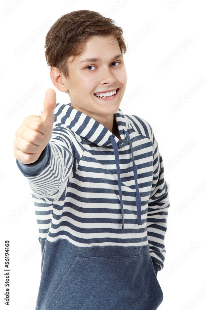 Cheerful attractive teen boy thumb up over white Cheerful attractive teen boy thumb up over white