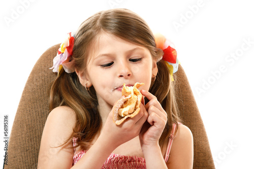 Little girl eating cake