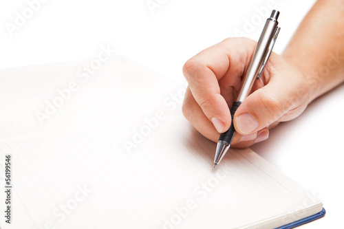 Man hand writing in open book isolated on white