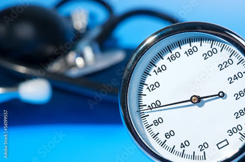 Stethoscope and sphygmomanometer on blue background