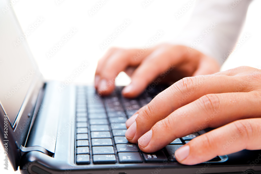 Businessman working on laptop over white Businessman working on laptop over white