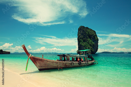 Boat near the sandy beach.