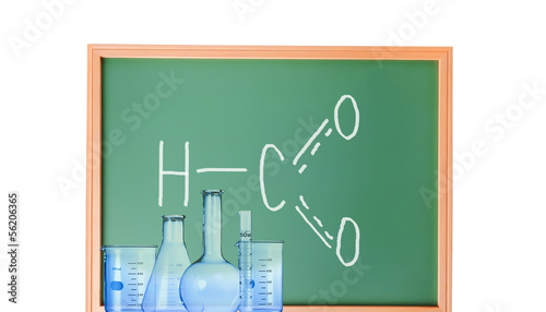 Test-tubes with various acids and other chemicals on the backgro photo