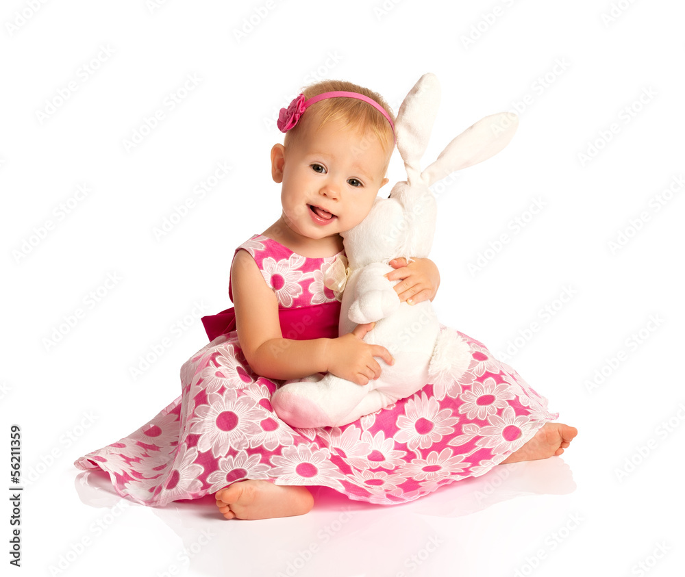 little baby girl hugging a toy bunny rabbit isolated on white little baby girl hugging a toy bunny rabbit isolated on white