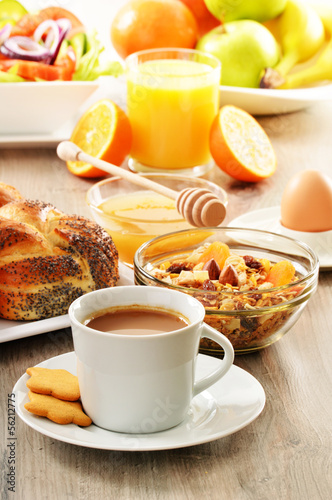 Breakfast including coffee  bread  honey  orange juice  muesli a