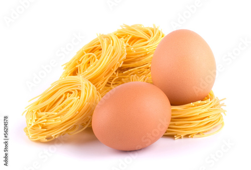 Eggs and pasta nest isolated on white background